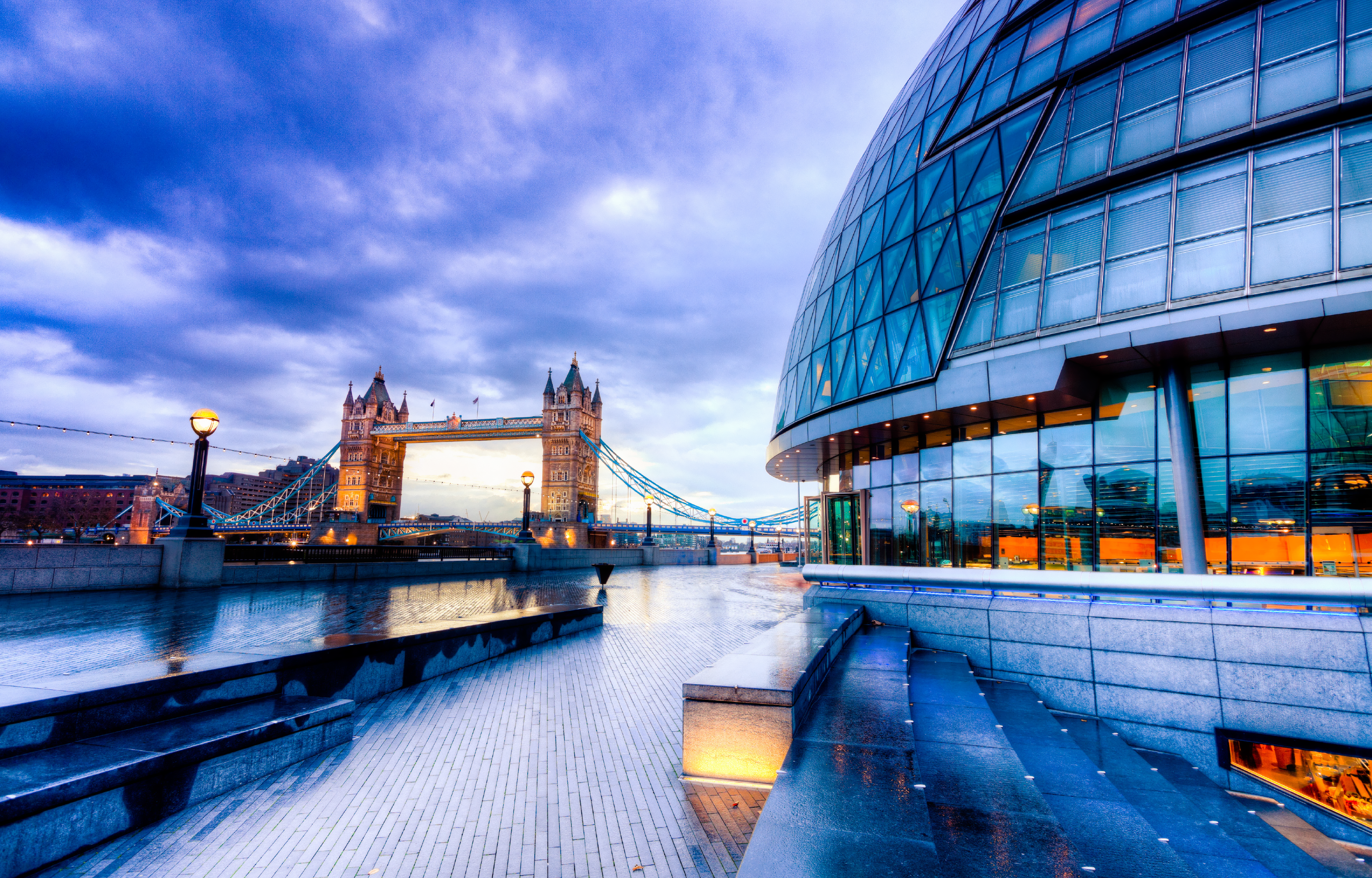 View of a bridge in the background, glass office building in the foreground