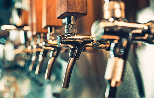 A row of pub taps shown in profile